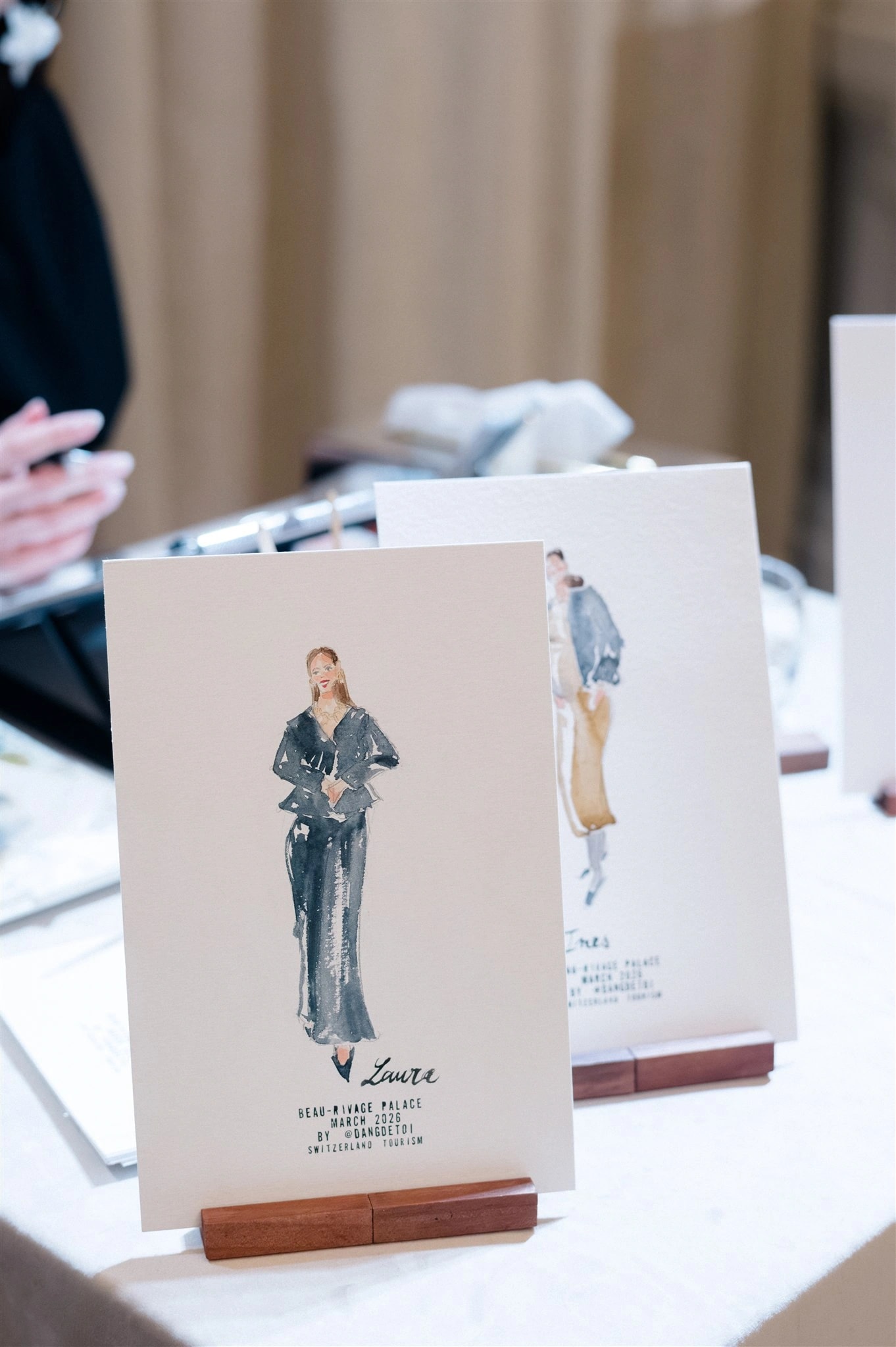 Watercolor guest portraits on wooden stands at Beau-Rivage Palace, Lausanne. © Youri Claessens