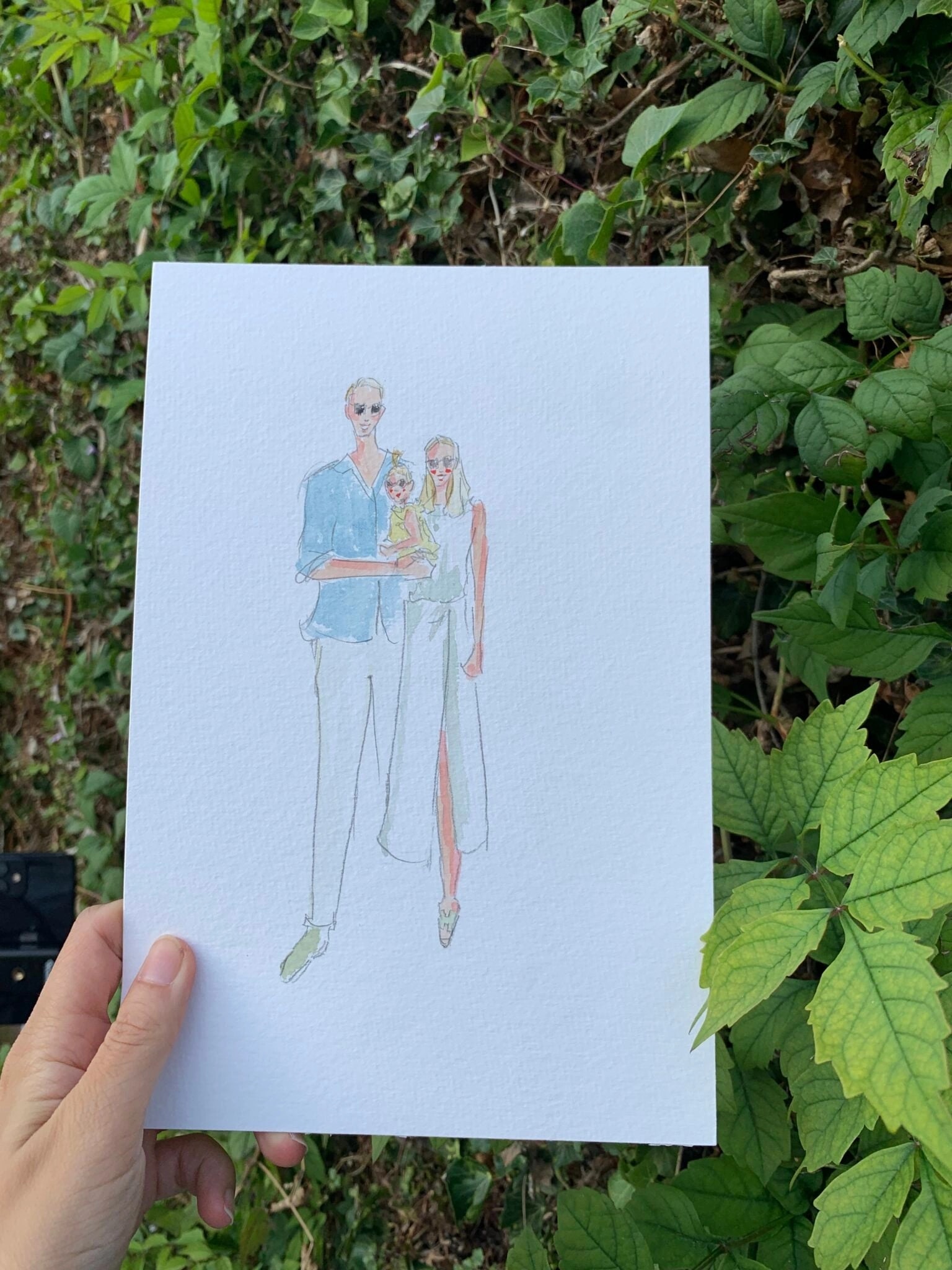 Live gemaltes Aquarell-Porträt einer Familie mit Baby an einer Hochzeit in Annecy.