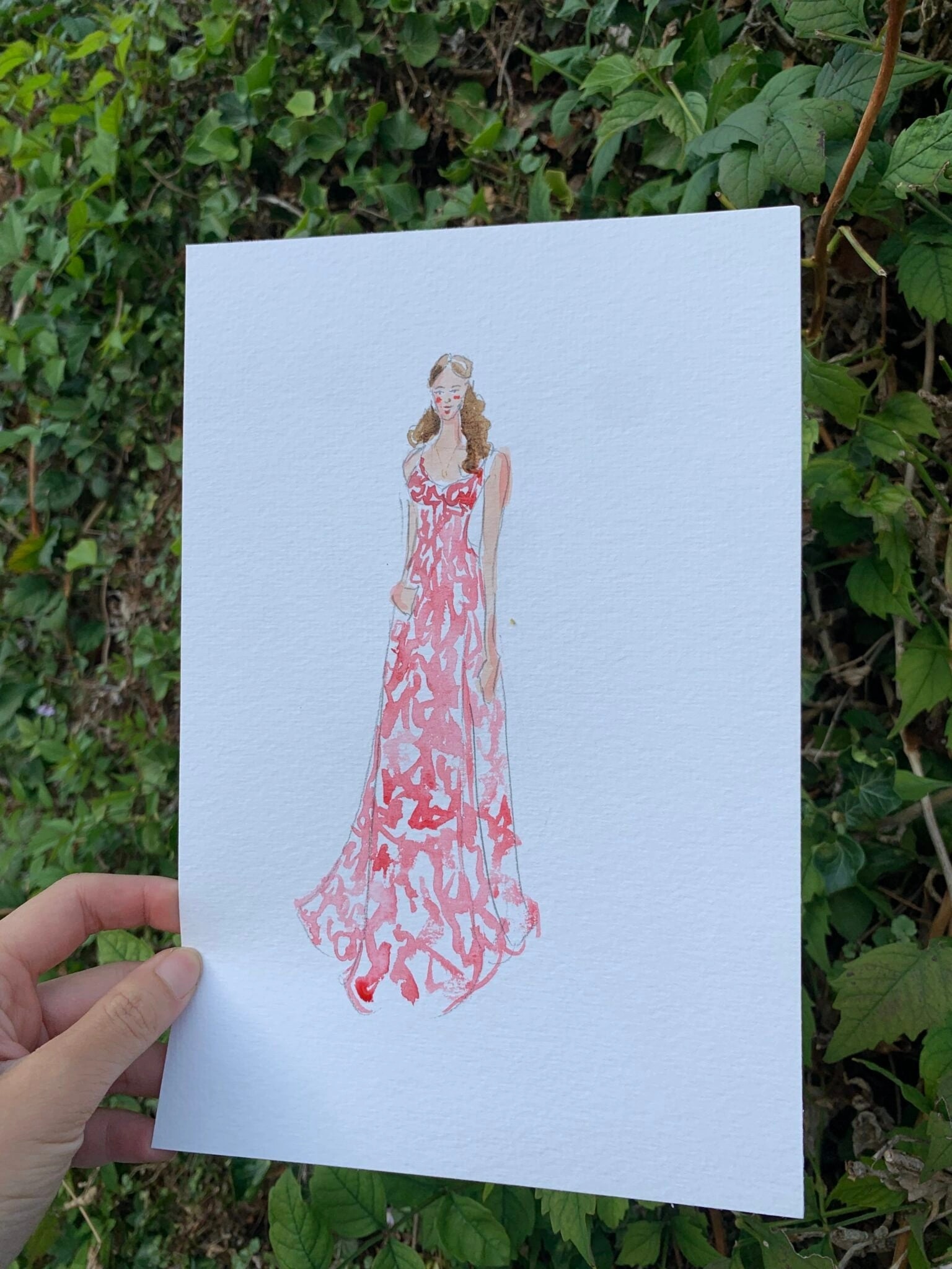 Live gemaltes Aquarell-Porträt eines Gasts im roten Kleid, Lac d’Annecy.