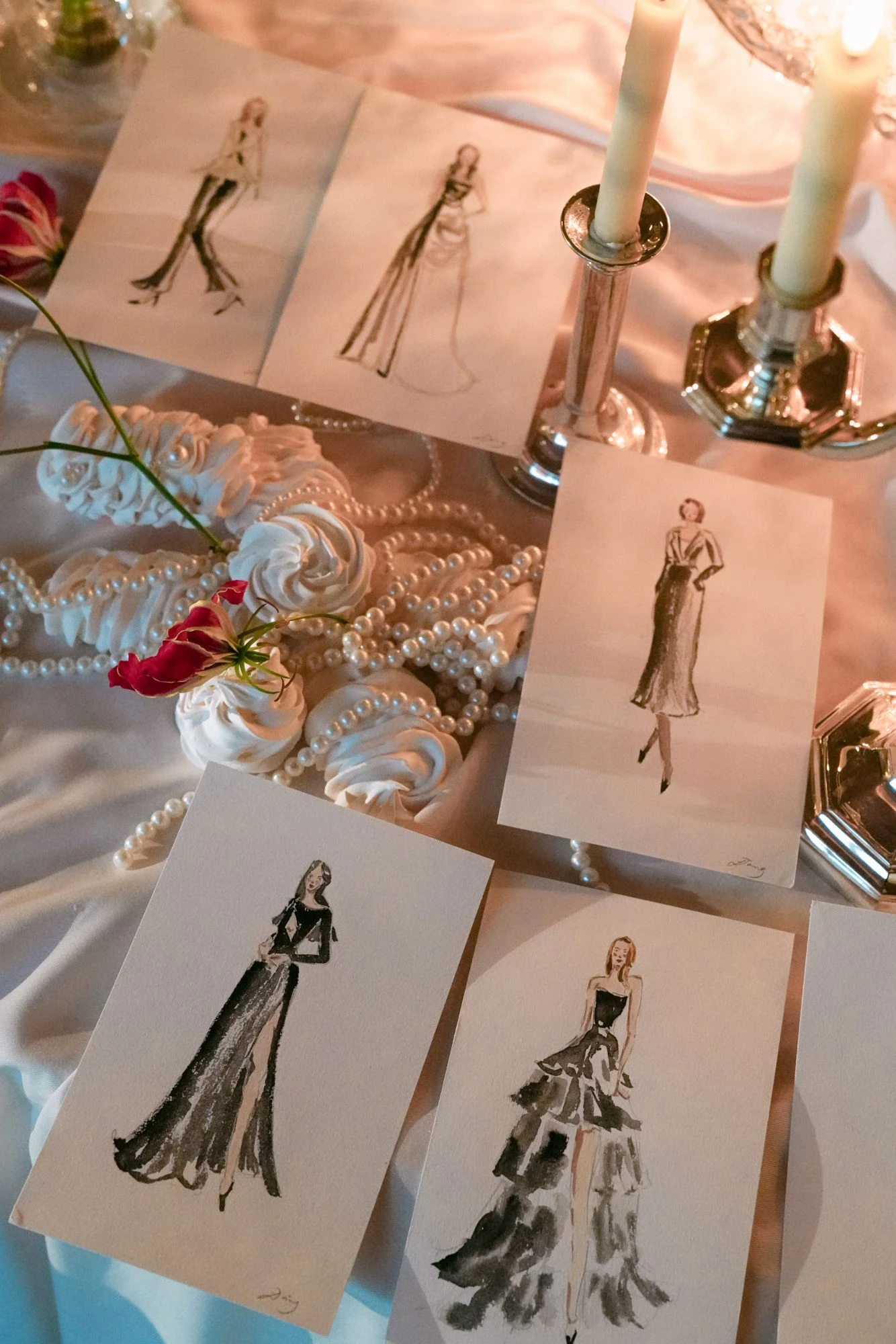 Live watercolor guest portraits on a candlelit table with pearls and meringues at the InterContinental Geneva