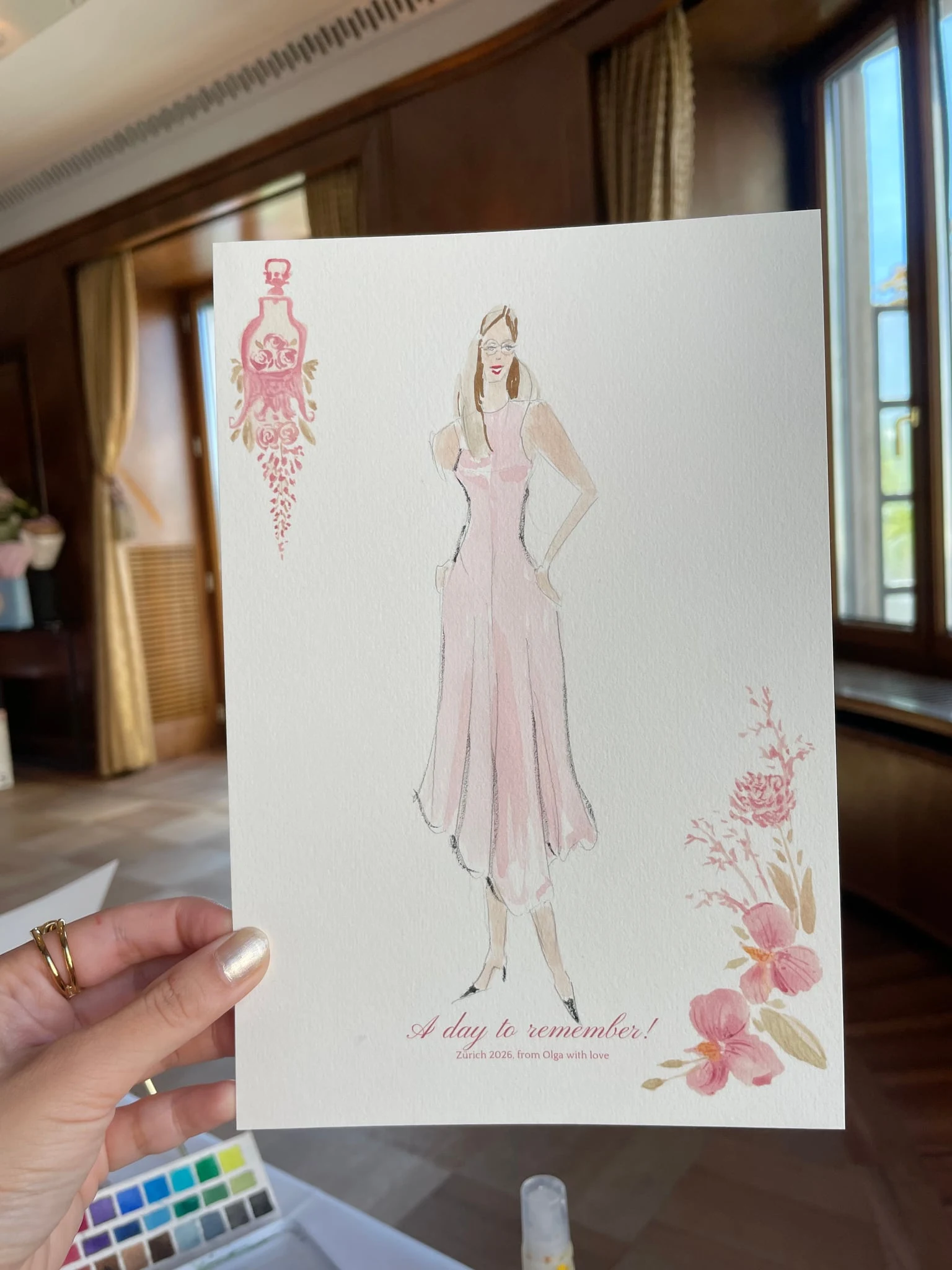 Live watercolor illustration of a guest in a pink dress at a birthday party at AMERON Zürich Bellerive au Lac.