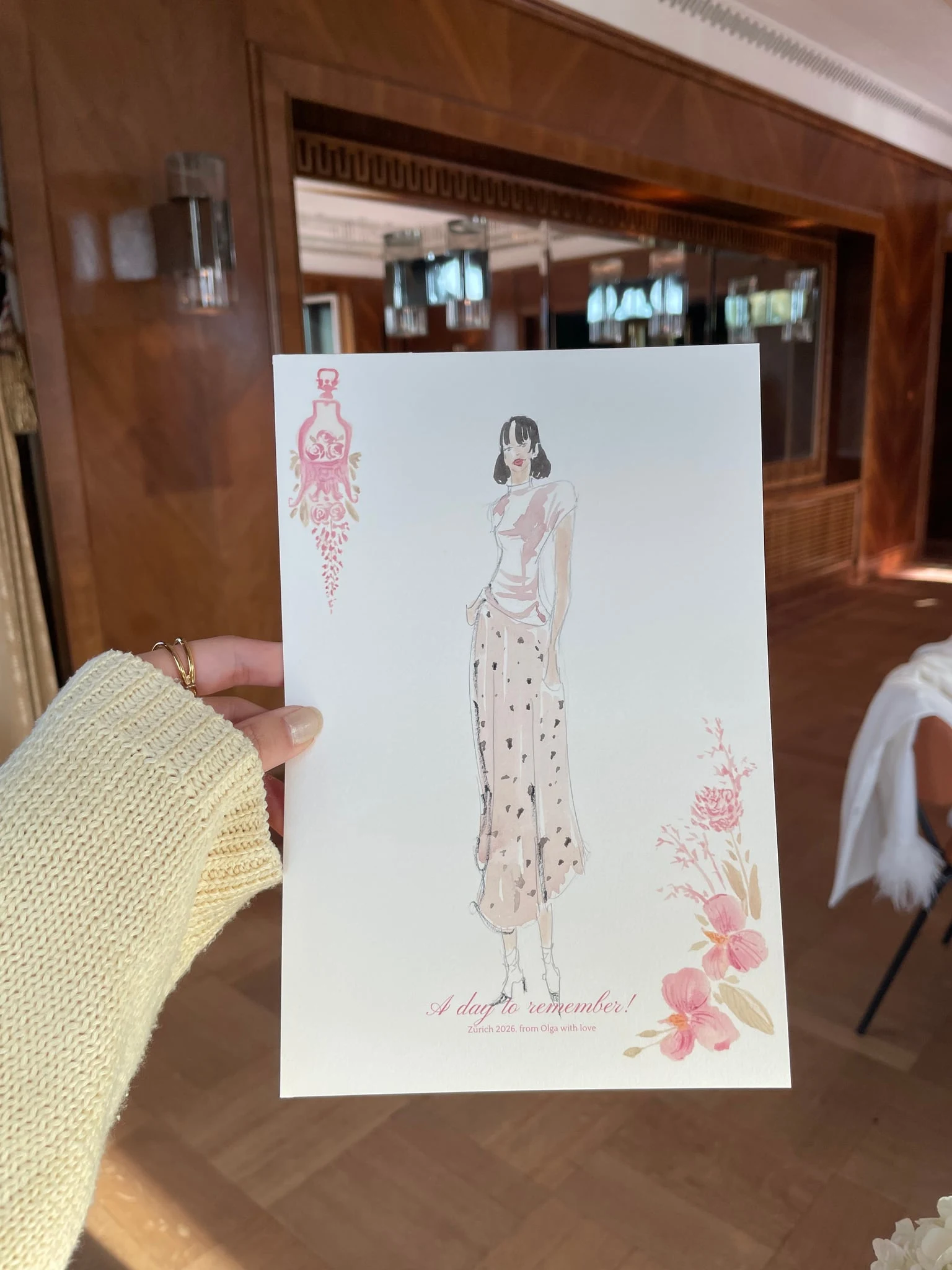 Live watercolor illustration of a guest in a polka-dot skirt at a birthday party at AMERON Zürich Bellerive au Lac.
