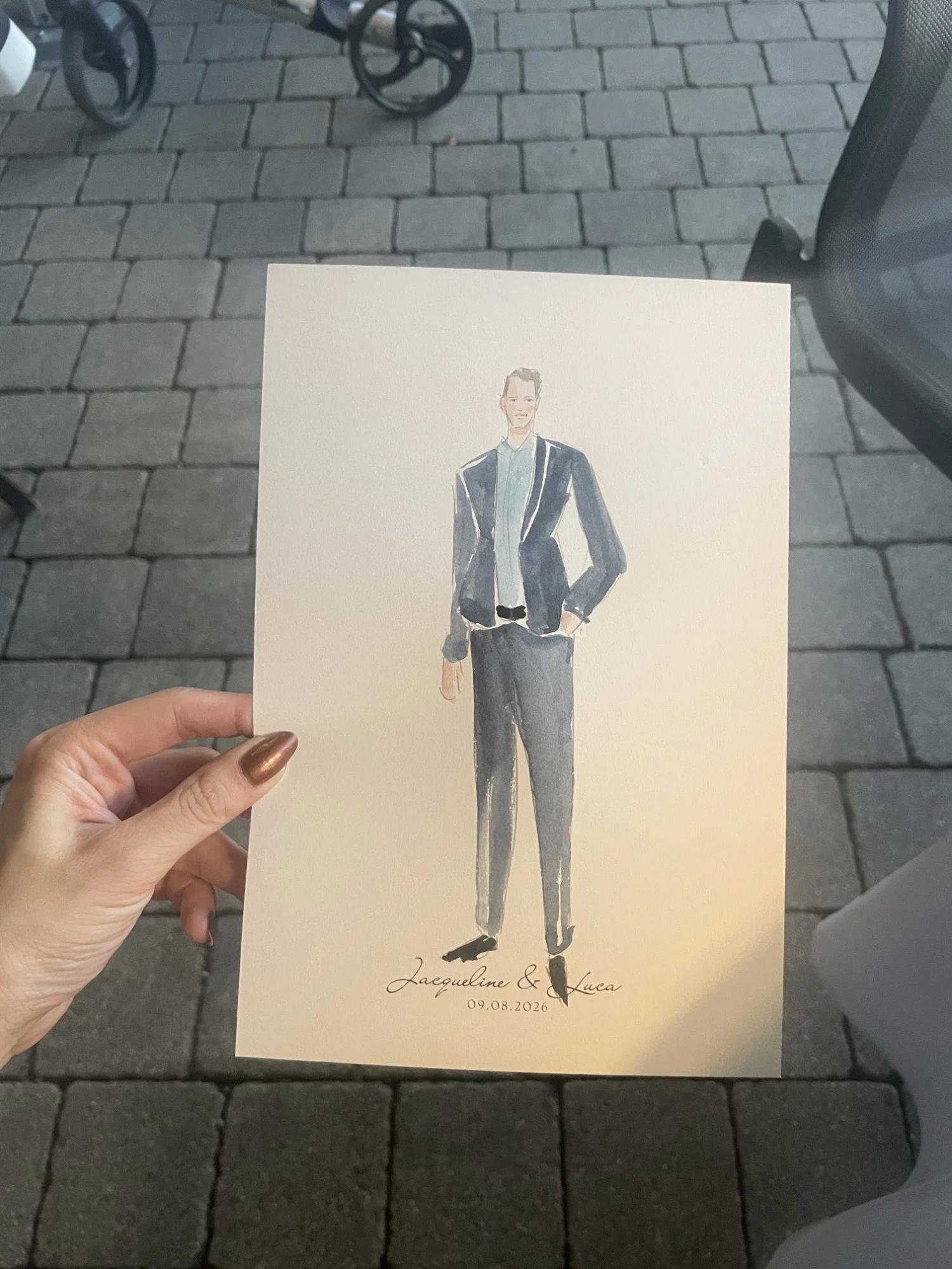 Live watercolor portrait of a wedding guest in a navy suit.