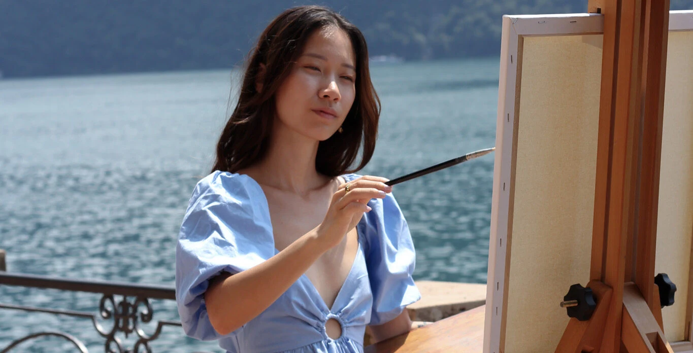Live wedding painter Khanh Linh Dang captured in action, painting a ceremony live on canvas in Lugano, Switzerland.