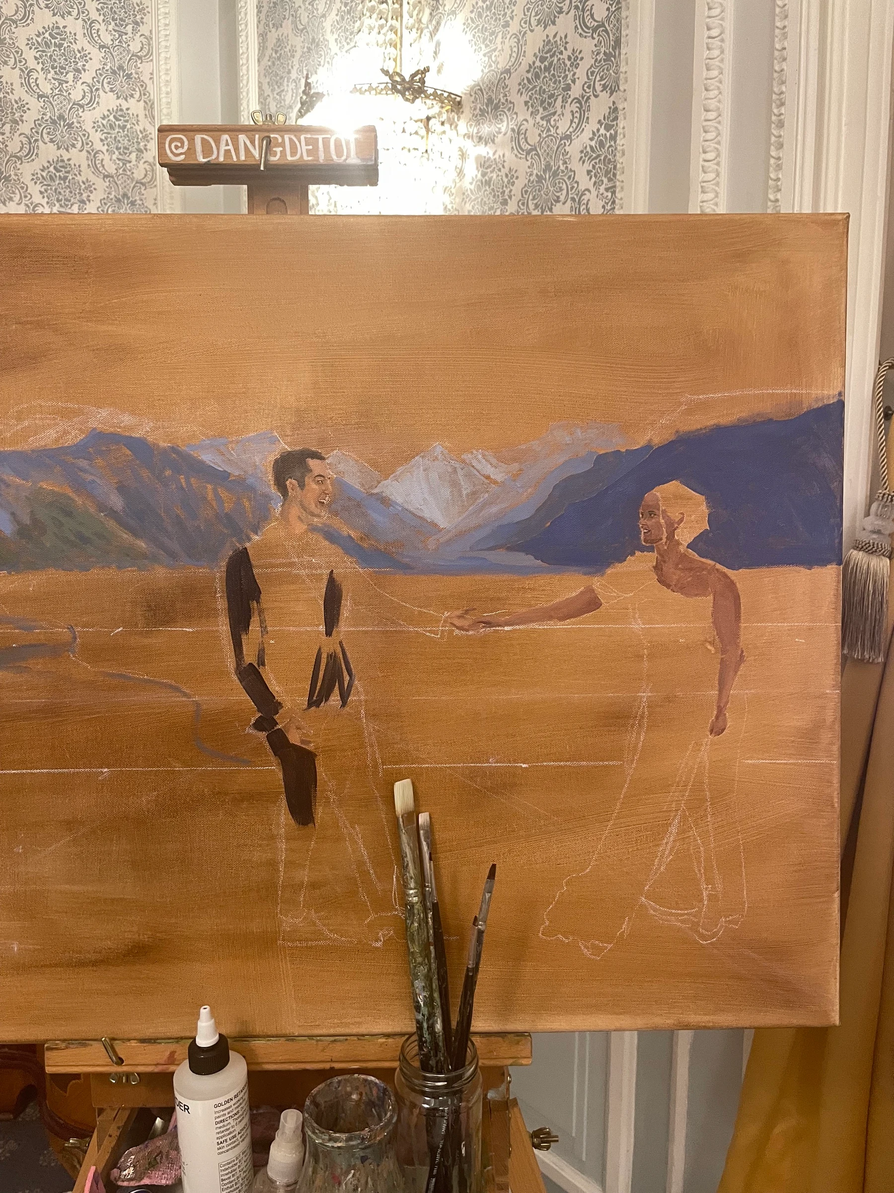 Live wedding painting in progress: the bride and groom dancing hand in hand with the Alps behind them, still unfinished