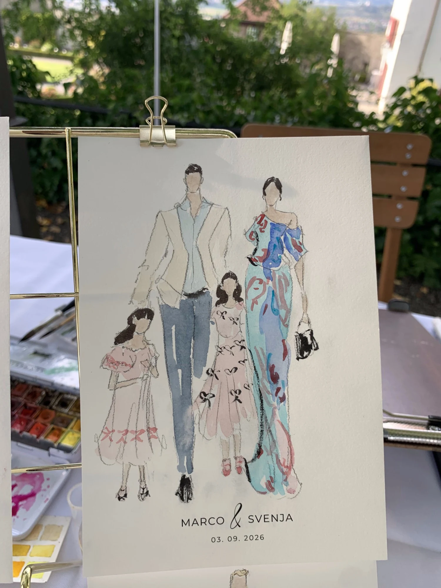Live watercolor fashion sketch of a guest family at Schloss Lenzburg: two girls in pink bow dresses with their parents.