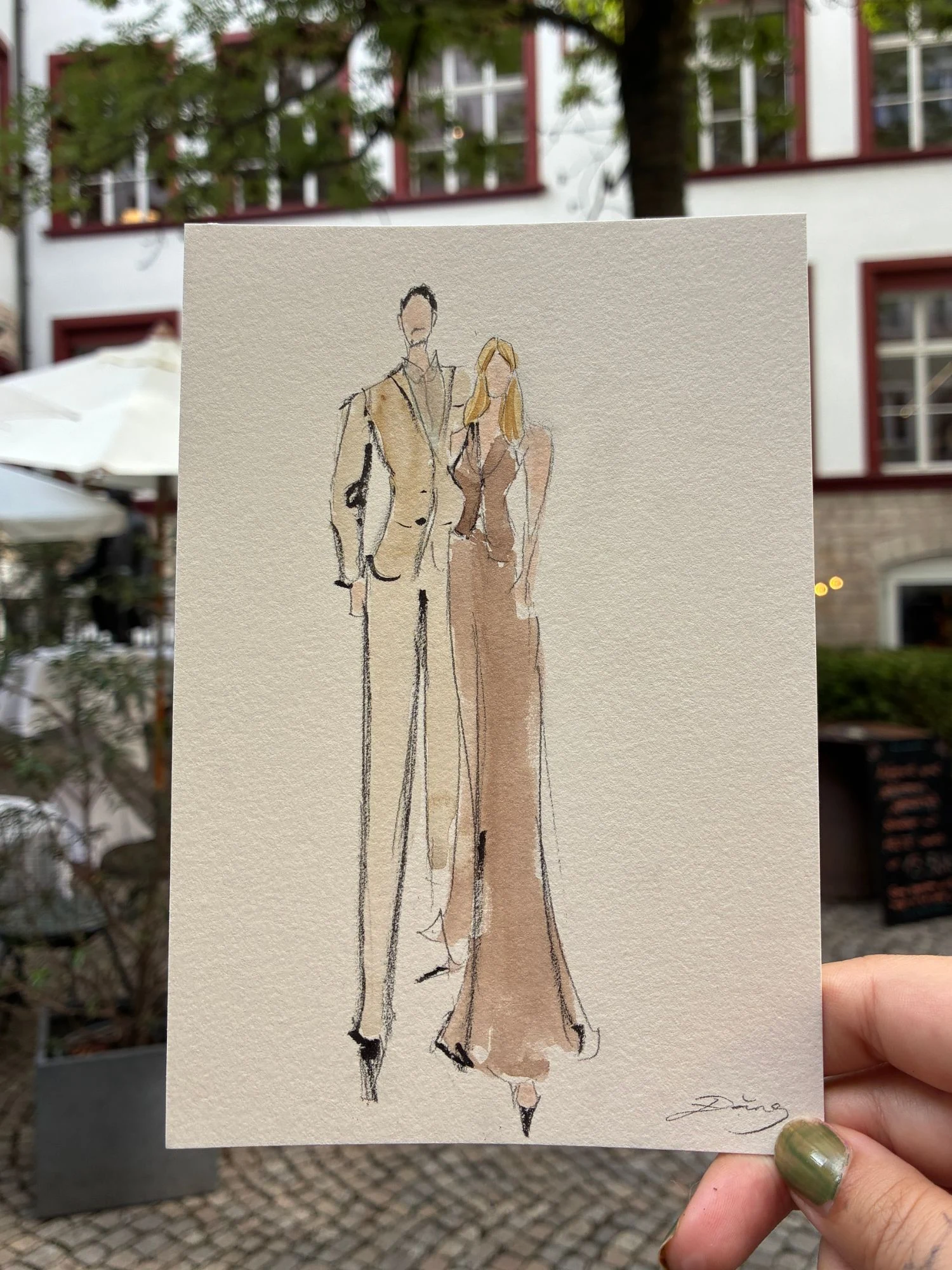 Live watercolor fashion sketch of a guest couple in caramel tones at a civil wedding in Basel.