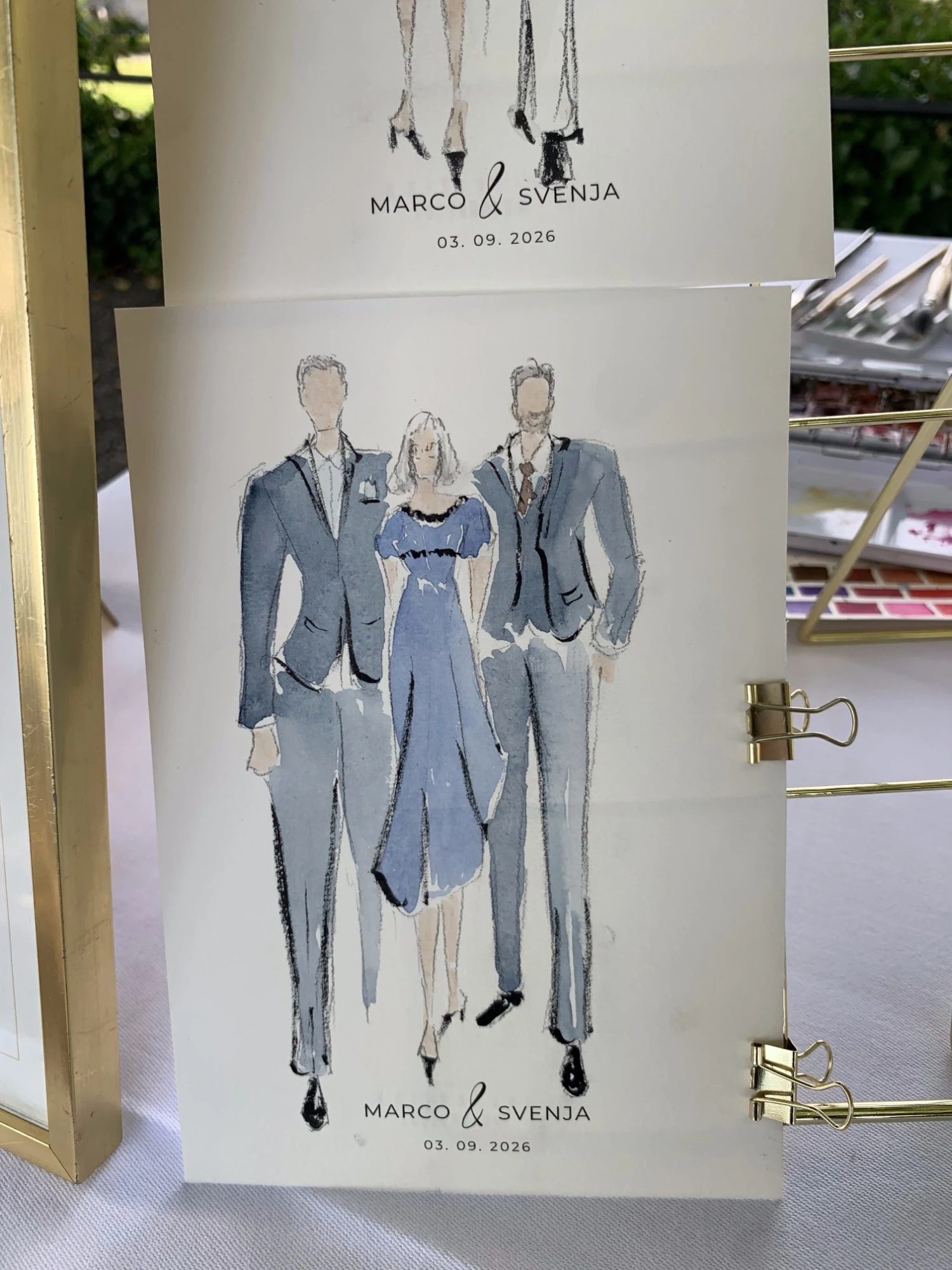 Live watercolor fashion sketch of three guests in shades of blue at Schloss Lenzburg.